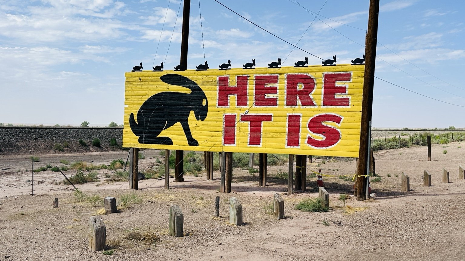 Yellow Here It Is roadside rabbit billboard